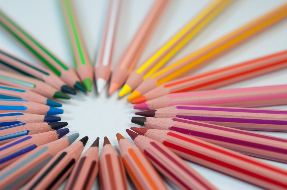 Coloured pencils arranged in a radiating circle